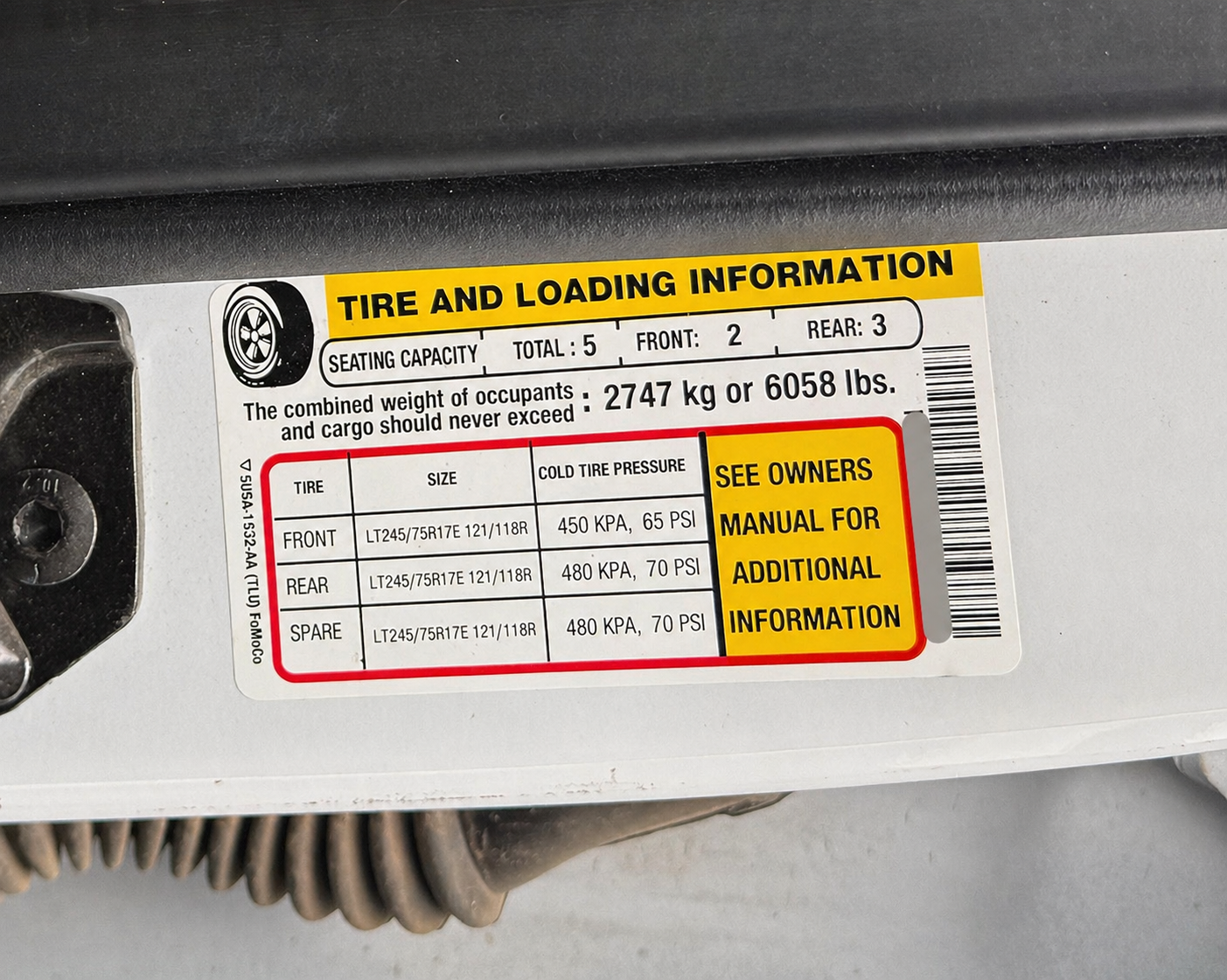 Truck payload door sticker showing max cargo weight